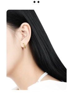 Detailed side view of a gold S925 sterling silver minimalist irregular wavy stud earring