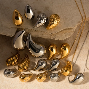 18K gold and silver water drop earrings with hammered texture on natural stone