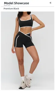Detail of high-waist yoga shorts with contrast binding and supportive cross-waist design