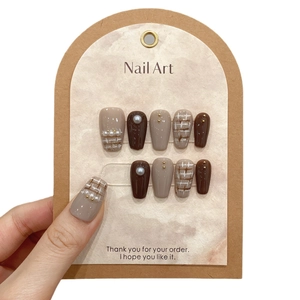 Handmade coffee brown and beige press-on nails with pearl accents and tweed pattern