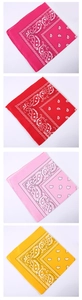 Detailed grid of paisley bandanas in rose, red, pink, and yellow polyester fabric