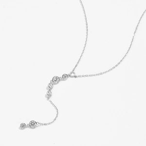 Macro shot of 925 sterling silver Y-necklace with sparkling round cubic zirconia stones
