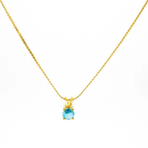 Detail of 18K gold-plated twisted rope chain with a round blue birthstone pendant