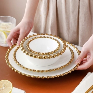 Modern white ceramic 3-piece dinnerware set with elegant gold bead edge and plates