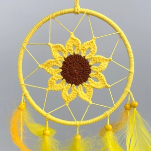 Handmade crochet sunflower dream catcher with yellow feathers for wall decor