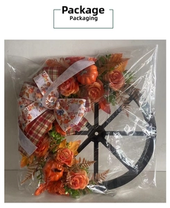 Detailed view of the Thanksgiving pumpkin wreath packaged in a transparent protective bag