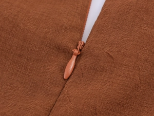 Macro view of seamless brown fabric texture with hidden invisible zipper detail