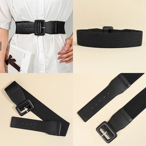 Detail view of black elastic wide waist belt with square buckle and PU leather texture