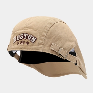 Close-up of khaki 5-panel hat featuring BOSTON 1985 embroidery and adjustable metal buckle