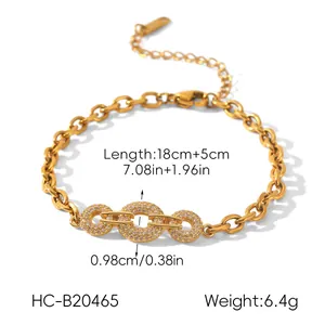Detail of gold chain bracelet with three interlocking rings and sparkling cubic zirconia stones
