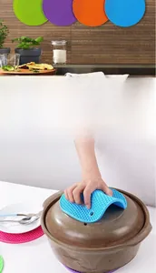 Detail showing colorful honeycomb silicone heat-resistant mats for kitchen use