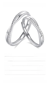Macro detail of S925 sterling silver Mobius couple rings with sparkling zircon inlay