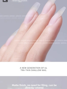 Macro shot of ultra-thin matte almond false nails with seamless fit and translucent finish