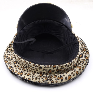Detail view of leopard print captain hat with inner mesh lining and gold chain trim