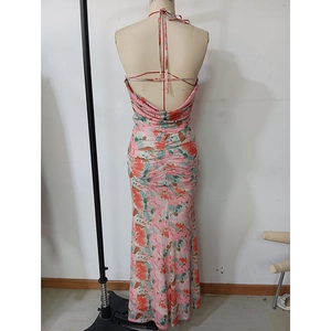 Back view of a floral halter dress showing elegant ruched detailing and slim mermaid fit