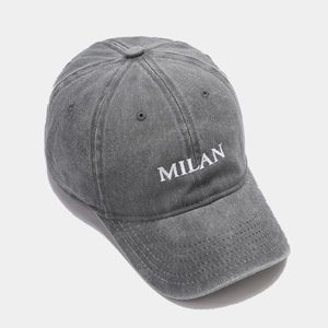 Close-up of Milan embroidery on dark grey washed vintage style cotton baseball cap