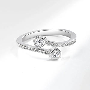 Elegant silver open ring with double heart-shaped stones and pavé set cubic zirconia