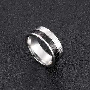Detail of 8mm silver stainless steel ring with black fiber inlay and Roman numerals
