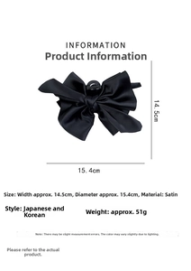 Detailed view of black satin bow hair claw clip showing dimensions 15.4cm by 14.5cm