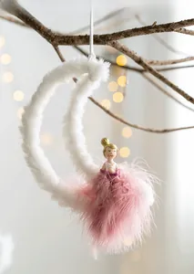 Detail of moon girl ornament featuring plush fabric and pink feather tutu for room decor
