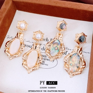 Elegant French shell oval pendant earrings set with pearls in baroque gold frame