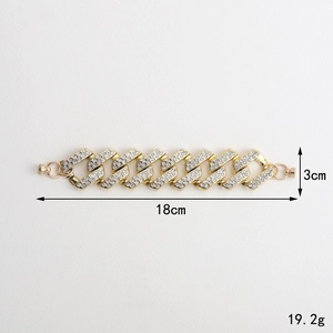 Golden rhinestone phone strap chain with dense sparkling crystals on white surface