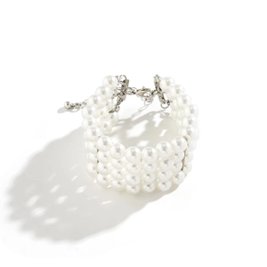 Detail of four-layer faux pearl necklace with silver-tone lobster clasp and extension chain