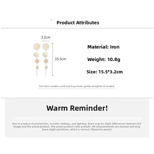 Detail of long gold drop earrings showing 15.5cm length and four gradient circles