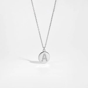 Detailed macro view of S925 silver necklace with round letter A zircon pendant