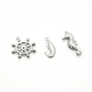 Silver stainless steel charms set featuring anchor, fish hook, and seahorse pendants