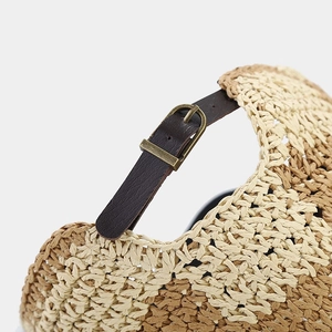 Straw checkered baseball cap with adjustable brown leather strap and gold metal buckle