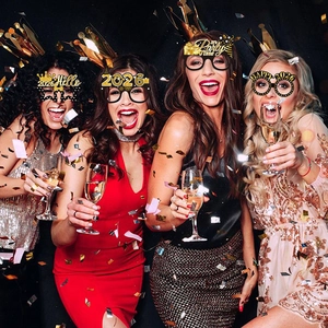 2026 New Year party glasses in black and gold glitter featuring festive holiday designs