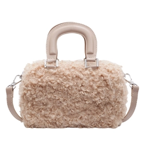 Chic beige faux shearling crossbody bag with leather handles and silver hardware