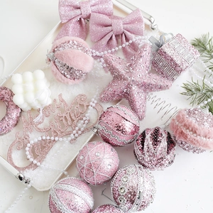 Pink Christmas ornaments set with glitter balls, bows, stars and Merry Christmas sign