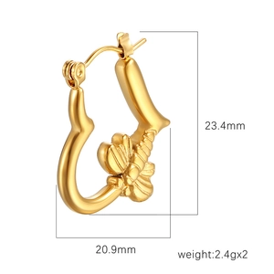 Golden heart-shaped stainless steel hoop earrings with delicate butterfly engraving