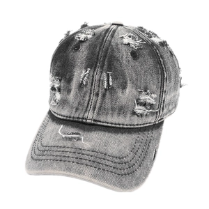 Vintage washed black distressed denim baseball cap with frayed holes and curved brim style