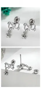 Detail of silver bow earrings with heart zircon and screw back closure for cartilage piercing