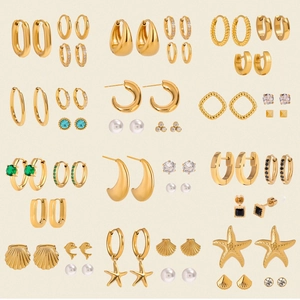 Luxurious gold stainless steel earring set featuring pearls and zircon star fish designs