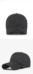 Detail view of charcoal grey winter baseball cap with delicate H letter embroidery