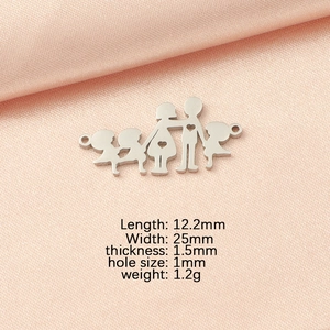 Macro view of family charm with size specs on pink silk background for DIY jewelry