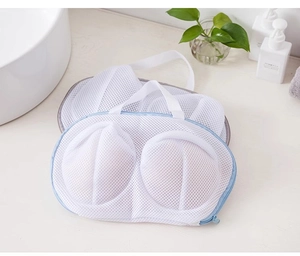 Close-up of mesh laundry bag for bras with blue zipper and convenient carry handle