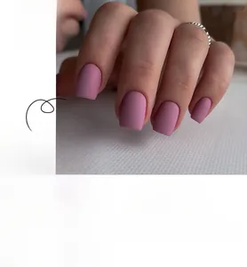 Detailed view of square matte mauve press-on nails shown on hand and laid flat