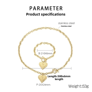 Detail view of gold-tone stainless steel heart pendant jewelry set with OT toggle clasp