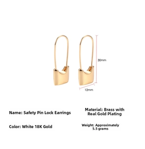 Macro shot of brass safety pin lock earrings with 18k gold plating details and measurements