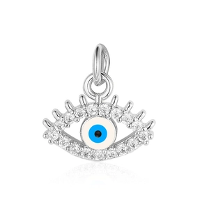 Macro shot of silver evil eye charm pendant with blue enamel and clear zircon stones