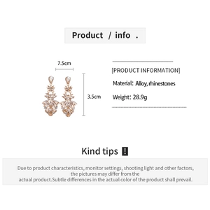 Detailed size view of luxury teardrop rhinestone earrings with champagne alloy finish