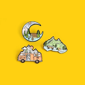 Cartoon outdoor camping enamel pins set featuring mountain views and forest cabins