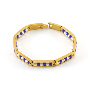 Detail of 18K gold-plated stainless steel bracelet with blue beads and folding clasp