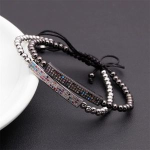 Macro shot of two adjustable beaded bracelets with colorful pavé cubic zirconia bars