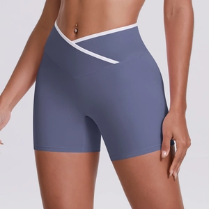 Detail of cross high waist misty blue yoga shorts with contrast white trim and stitching
